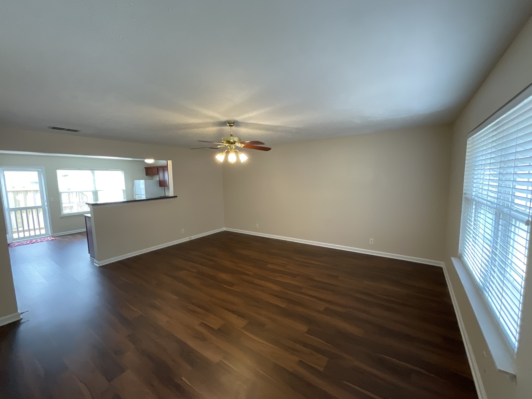 304 Shoshone Place Murfreesboro, TN 37128 - Photo 5 of 29 wooden floor in an empty room with a window