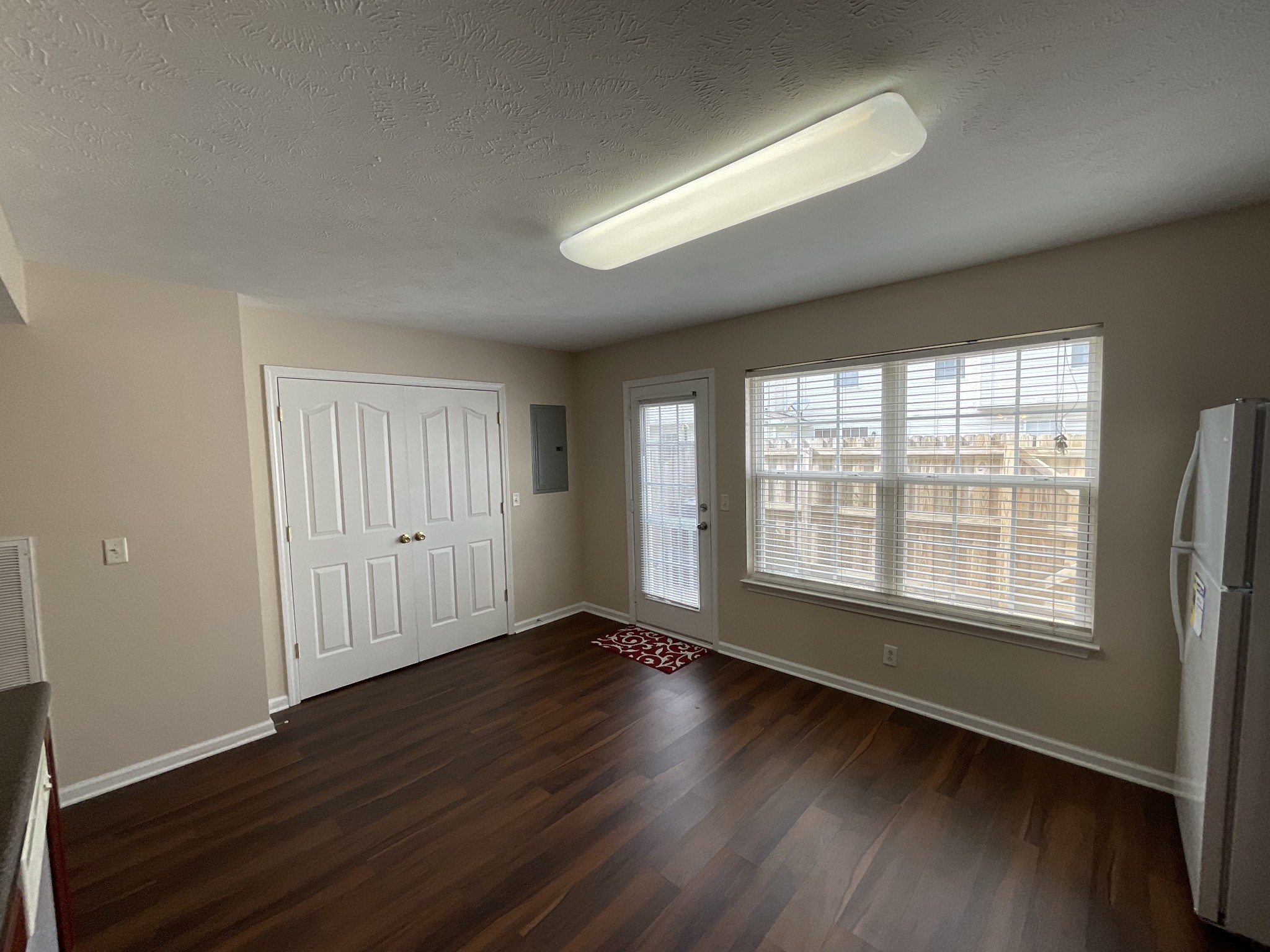 304 Shoshone Place Murfreesboro, TN 37128 - Photo 9 of 29 a view of an empty room with wooden floor and a window