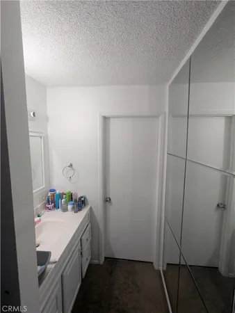 a bathroom with a sink and shower