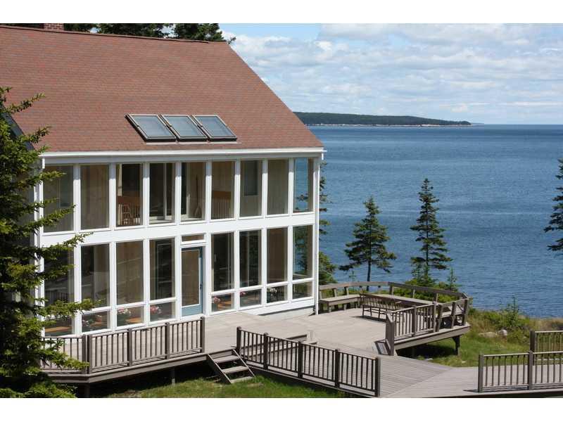 256 Red Point Road Swans Island, ME 04685 - Photo 1 of 32 View. View from the hill down to the...