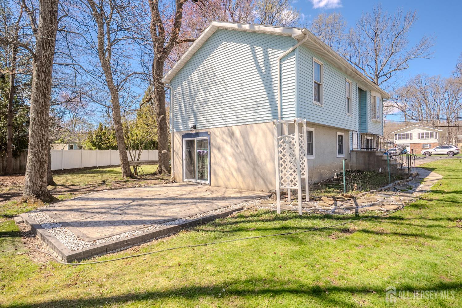 1834 Holly Road North Brunswick, NJ 08902 - Photo 20 of 26 a view of a house with a swimming pool