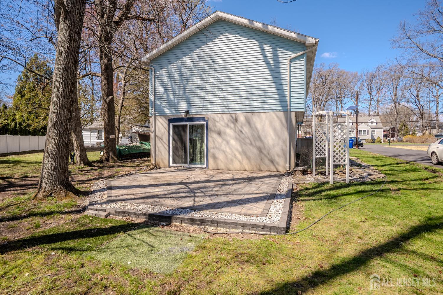 1834 Holly Road North Brunswick, NJ 08902 - Photo 22 of 26 a view of a house with pool and sitting area