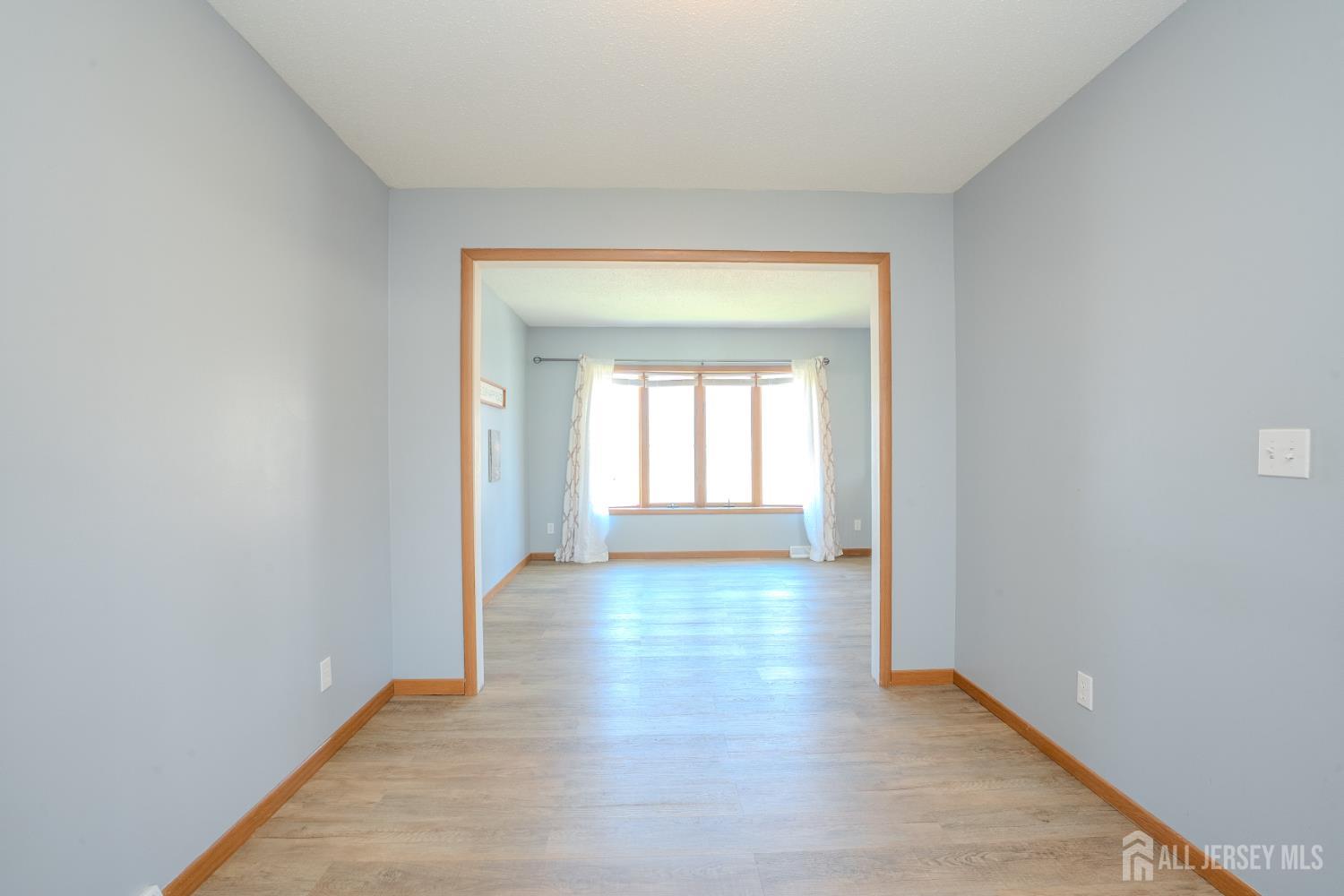 1834 Holly Road North Brunswick, NJ 08902 - Photo 8 of 26 a view of a room with wooden floor and a window