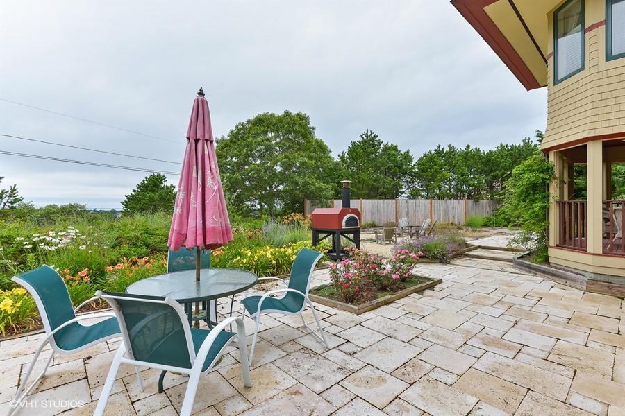 5 Parker Drive Truro, MA 02666 - Photo 14 of 20 a front view of a house with patio
