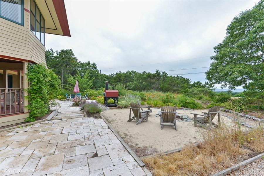 5 Parker Drive Truro, MA 02666 - Photo 15 of 20 a view of a backyard with sitting area