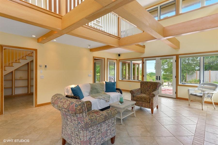 5 Parker Drive Truro, MA 02666 - Photo 4 of 20 a living room with furniture and large windows