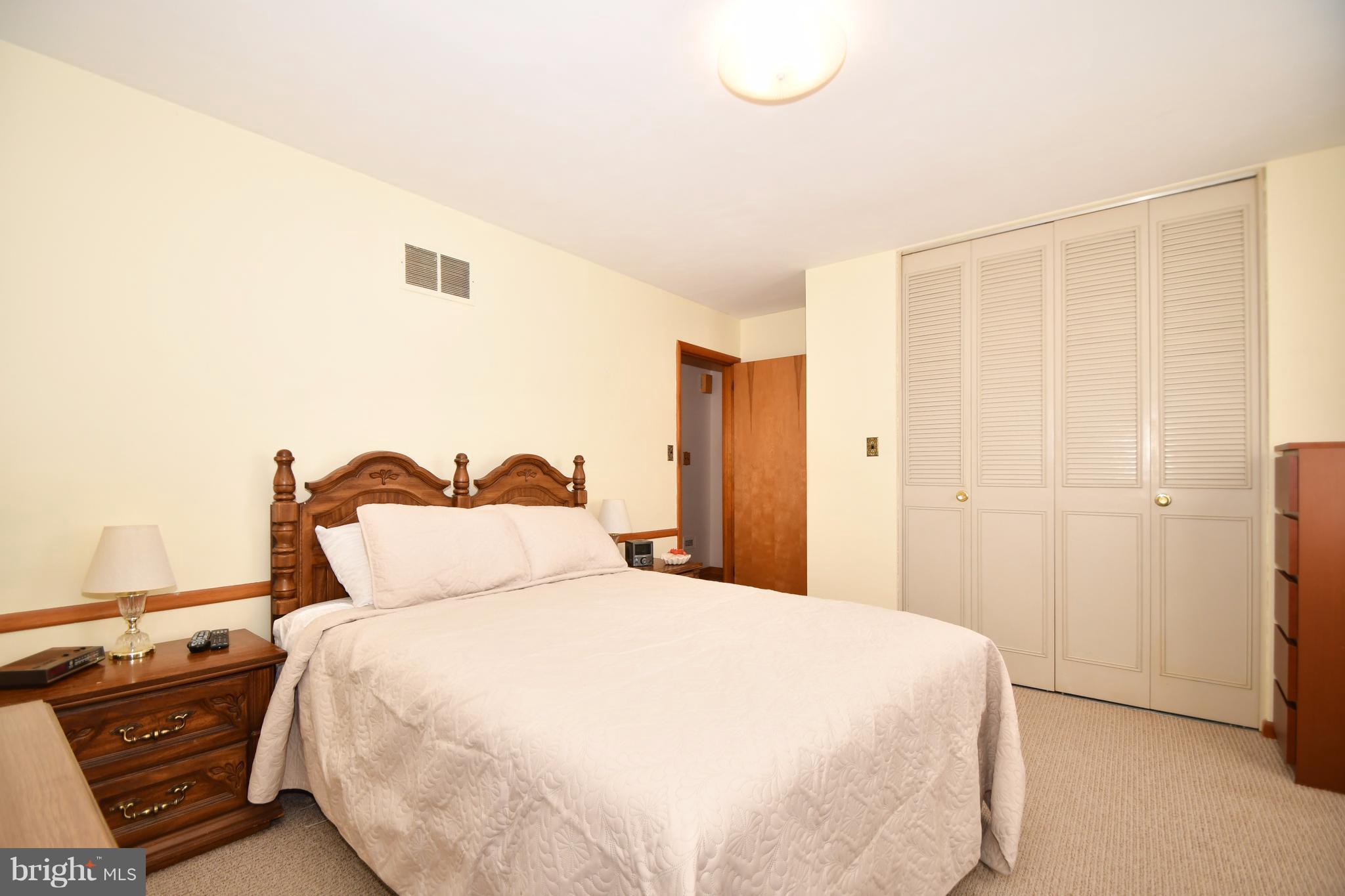 4314 Camellia Road Baltimore, MD 21236 - Photo 11 of 30 a bedroom with a bed and a night stand