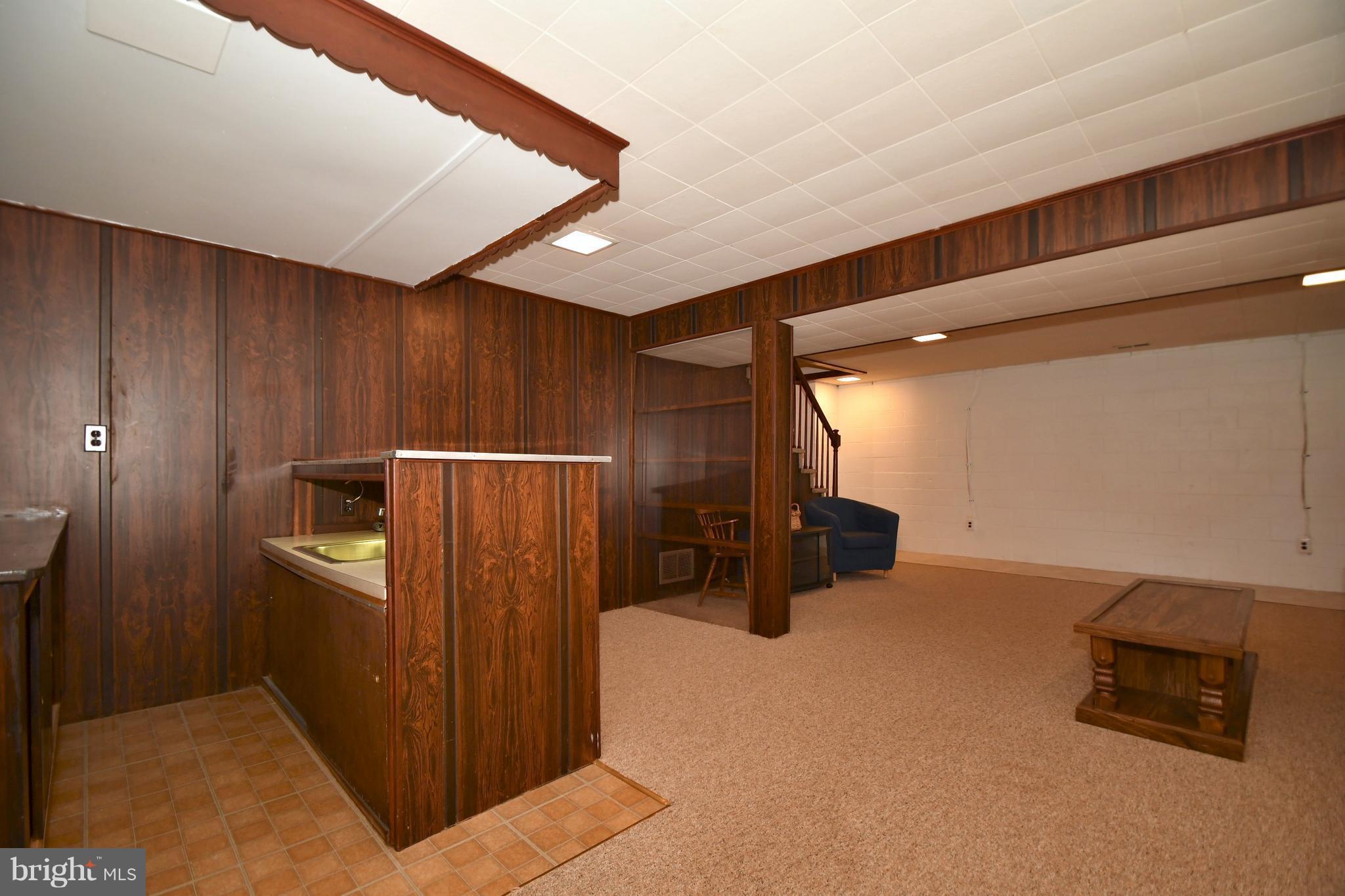 4314 Camellia Road Baltimore, MD 21236 - Photo 23 of 30 a view of an empty room with furniture and a window