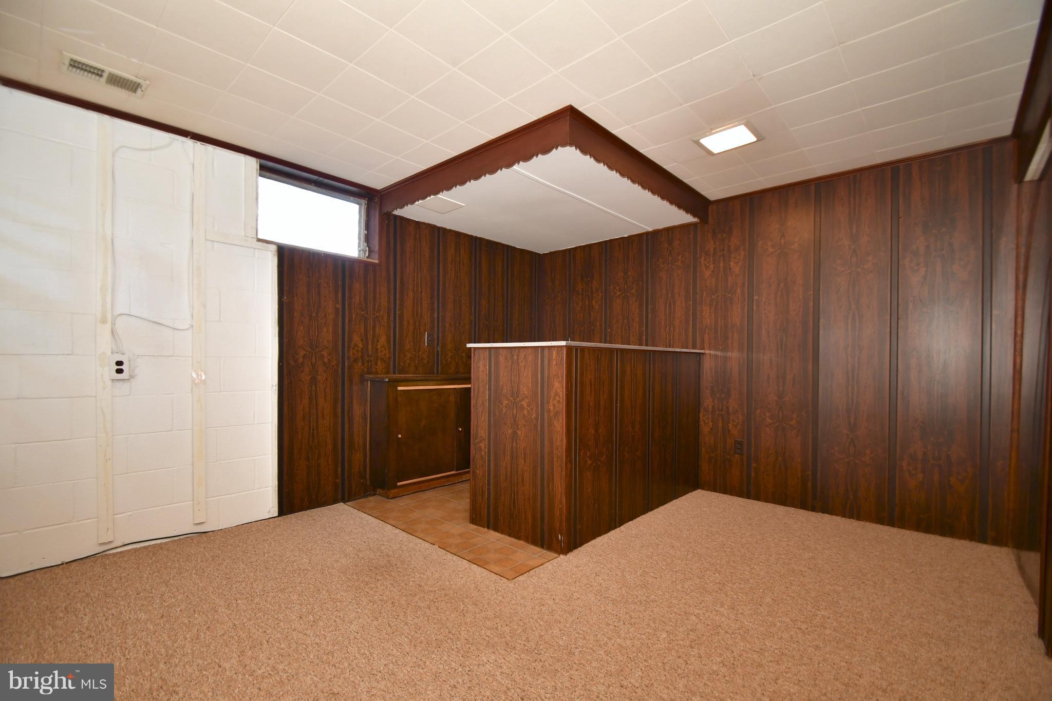 4314 Camellia Road Baltimore, MD 21236 - Photo 24 of 30 a view of empty room with wooden walls