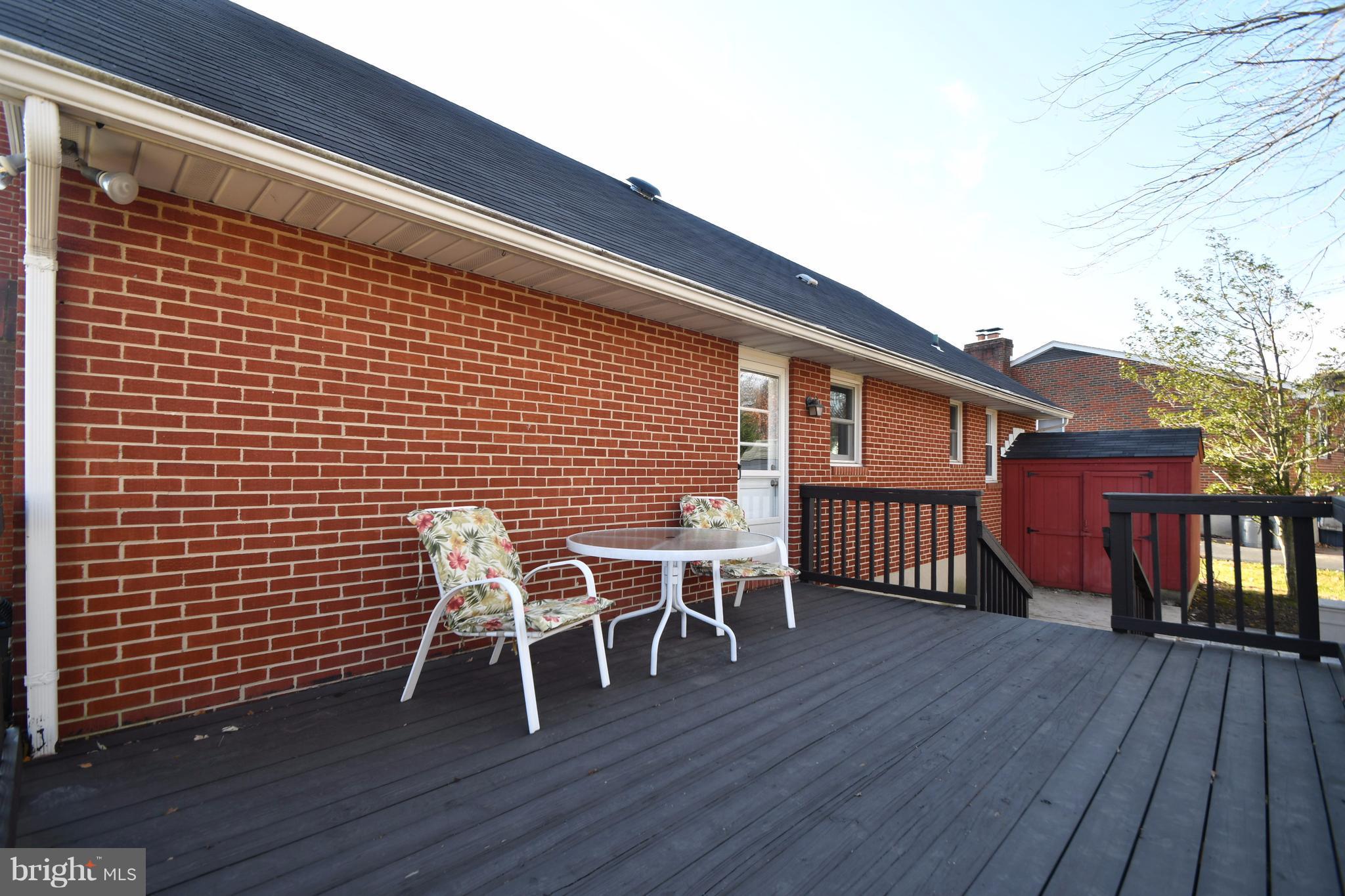4314 Camellia Road Baltimore, MD 21236 - Photo 26 of 30 a patio with table and chairs