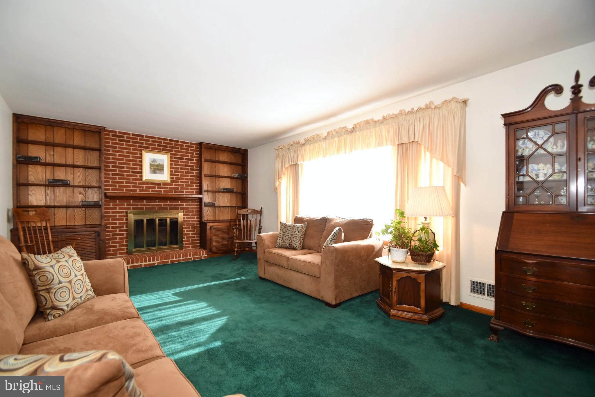 4314 Camellia Road Baltimore, MD 21236 - Photo 4 of 30 a living room with furniture a window and kitchen view