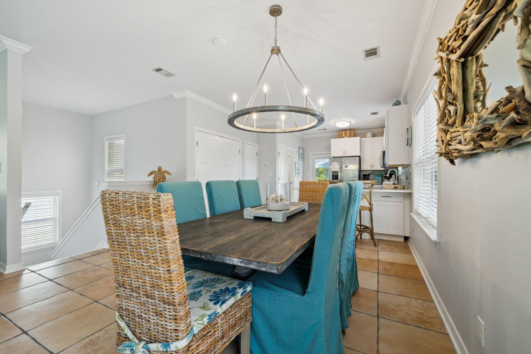 104 Emerald Dunes Circle Santa Rosa Beach, FL 32459 - Photo 13 of 53 a dining room with furniture and a chandelier