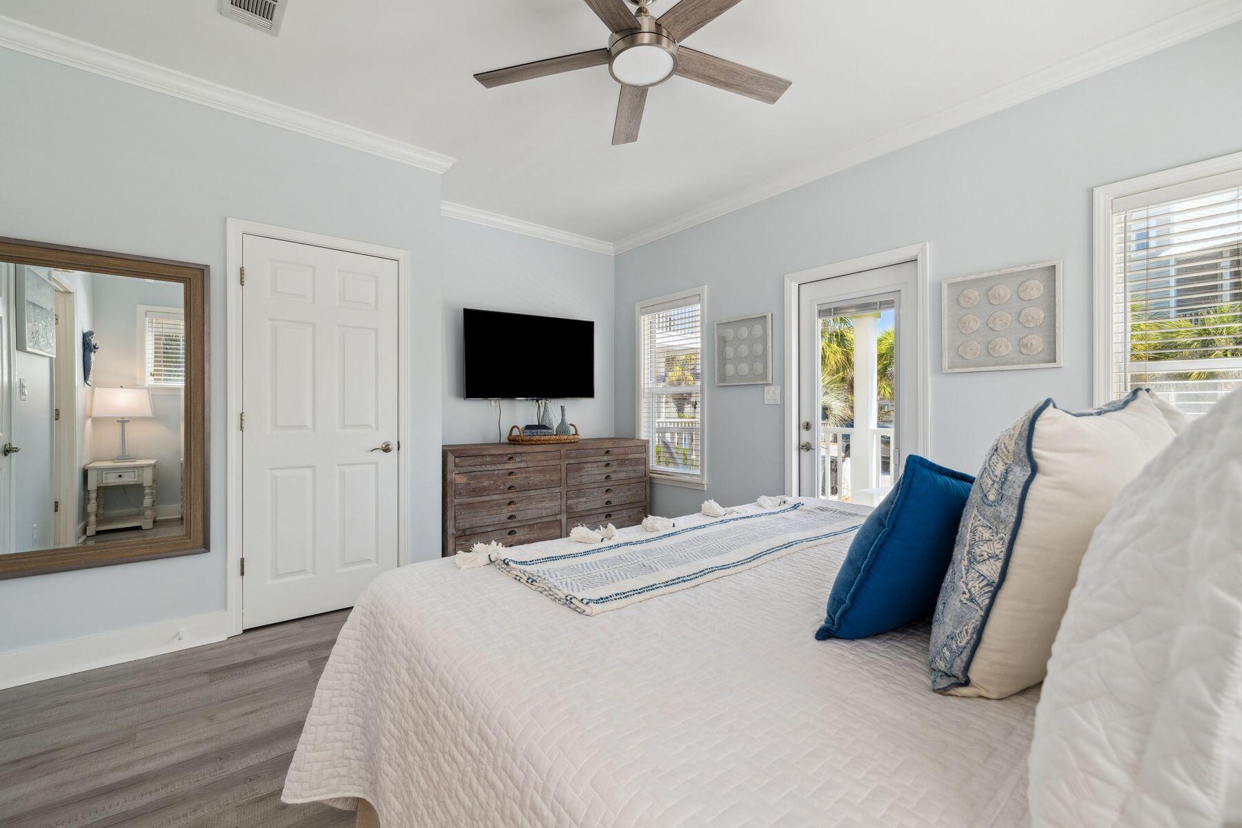 104 Emerald Dunes Circle Santa Rosa Beach, FL 32459 - Photo 21 of 53 a bedroom with a bed window and a flat screen tv