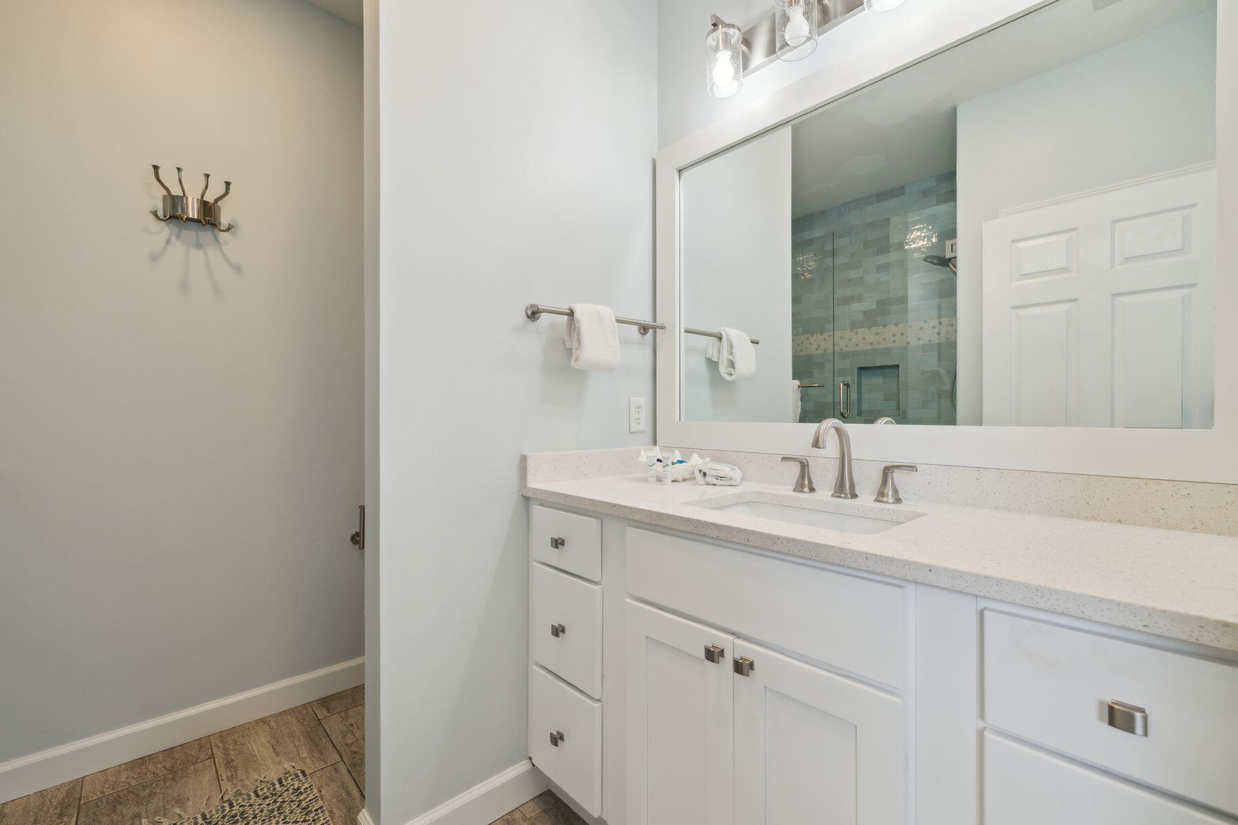104 Emerald Dunes Circle Santa Rosa Beach, FL 32459 - Photo 23 of 53 a bathroom with a sink and a mirror