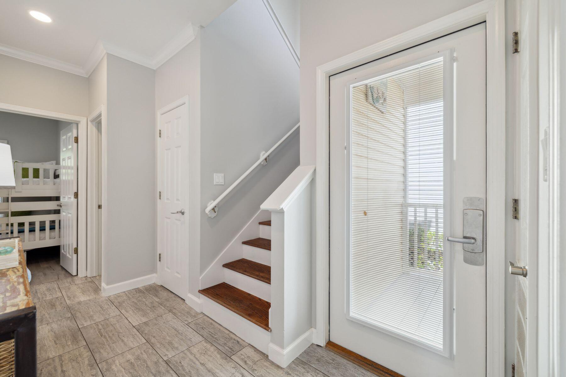 104 Emerald Dunes Circle Santa Rosa Beach, FL 32459 - Photo 27 of 53 a view of entryway with wooden floor and furniture