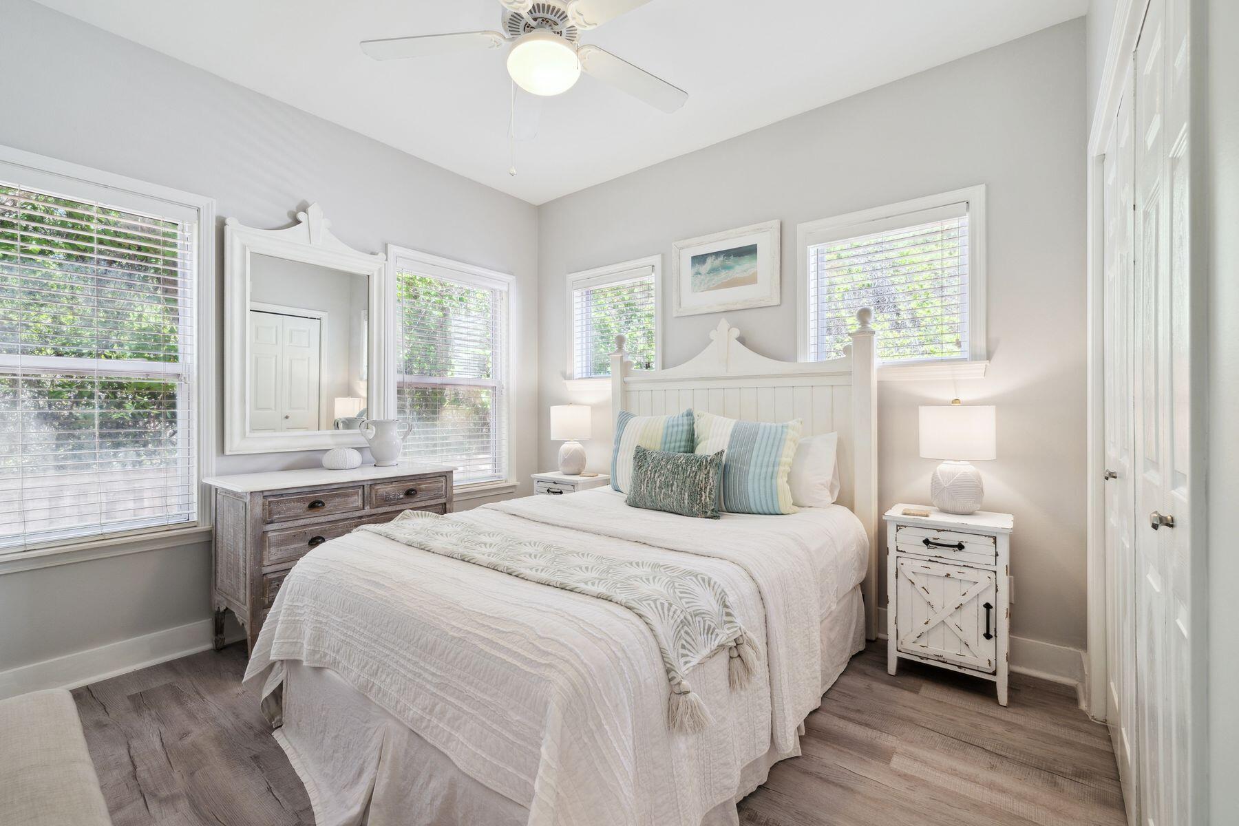 104 Emerald Dunes Circle Santa Rosa Beach, FL 32459 - Photo 31 of 53 a bedroom with a bed and a window with chair