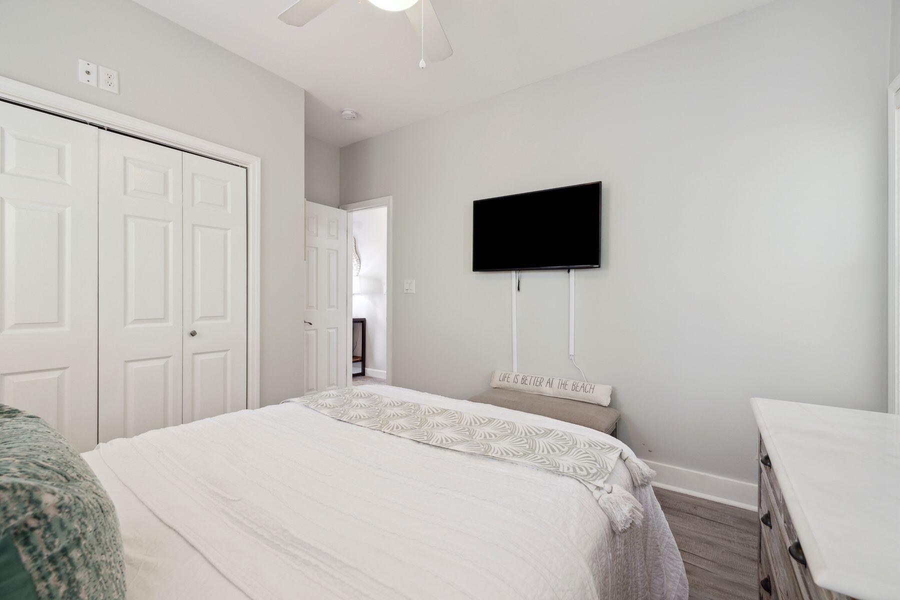 104 Emerald Dunes Circle Santa Rosa Beach, FL 32459 - Photo 33 of 53 a bedroom with a bed and a flat screen tv