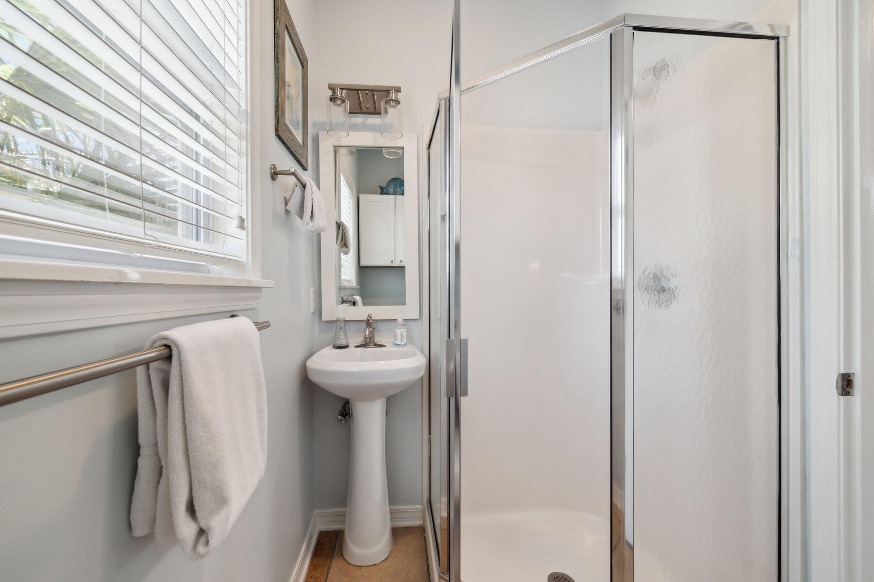 104 Emerald Dunes Circle Santa Rosa Beach, FL 32459 - Photo 35 of 53 a bathroom with a shower and a sink