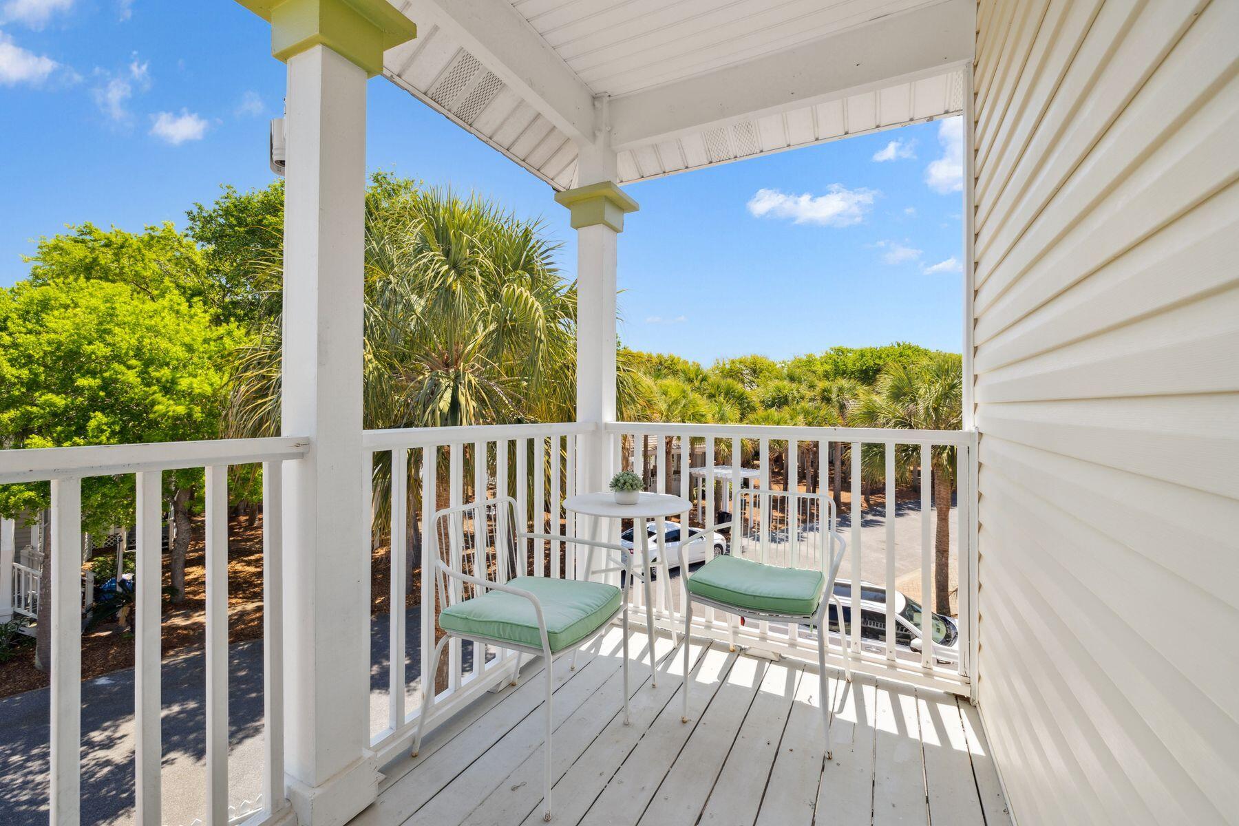 104 Emerald Dunes Circle Santa Rosa Beach, FL 32459 - Photo 37 of 53 a view of balcony with two chairs and wooden floor