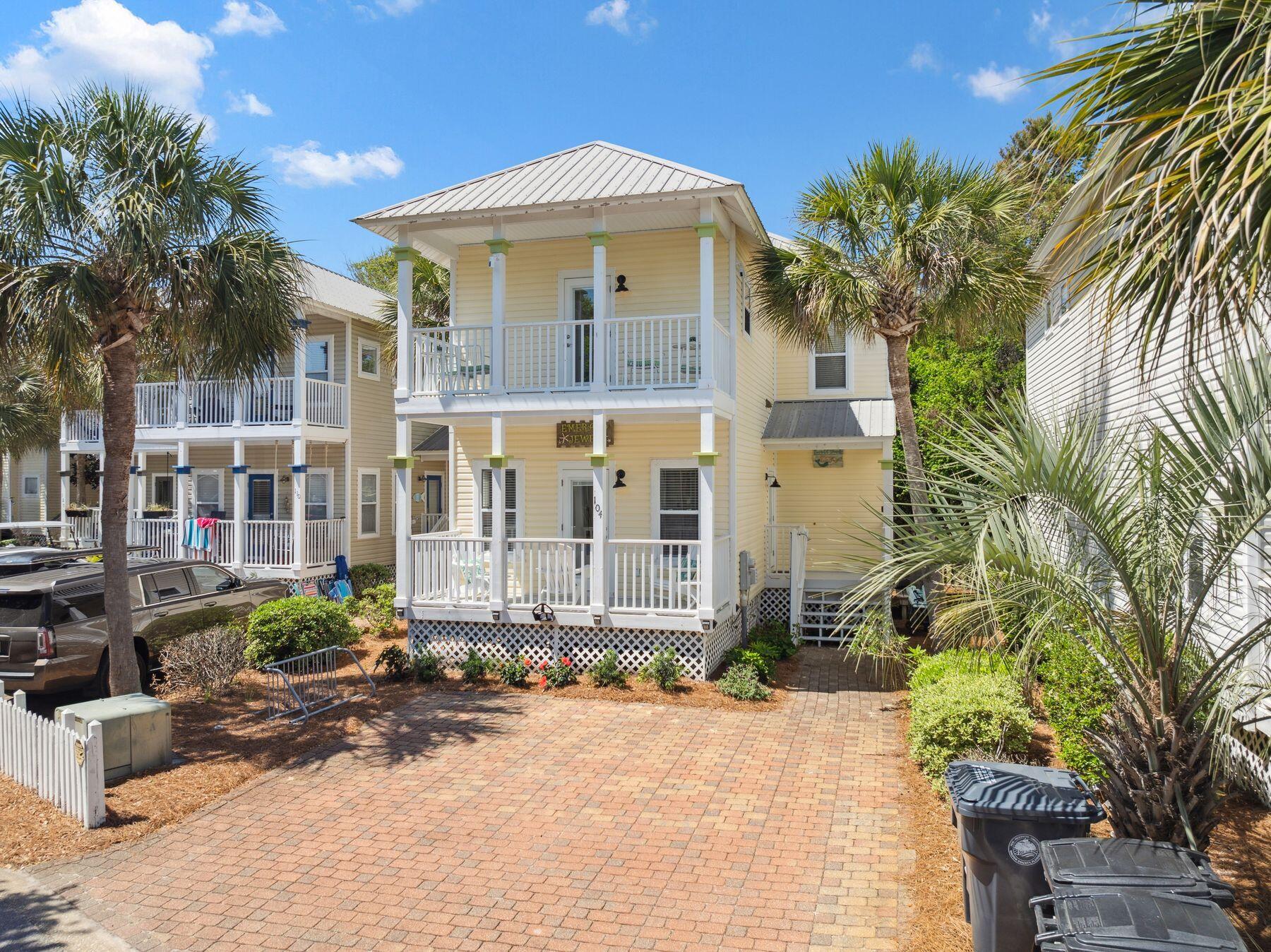 104 Emerald Dunes Circle Santa Rosa Beach, FL 32459 - Photo 50 of 53 a front view of a house with a yard