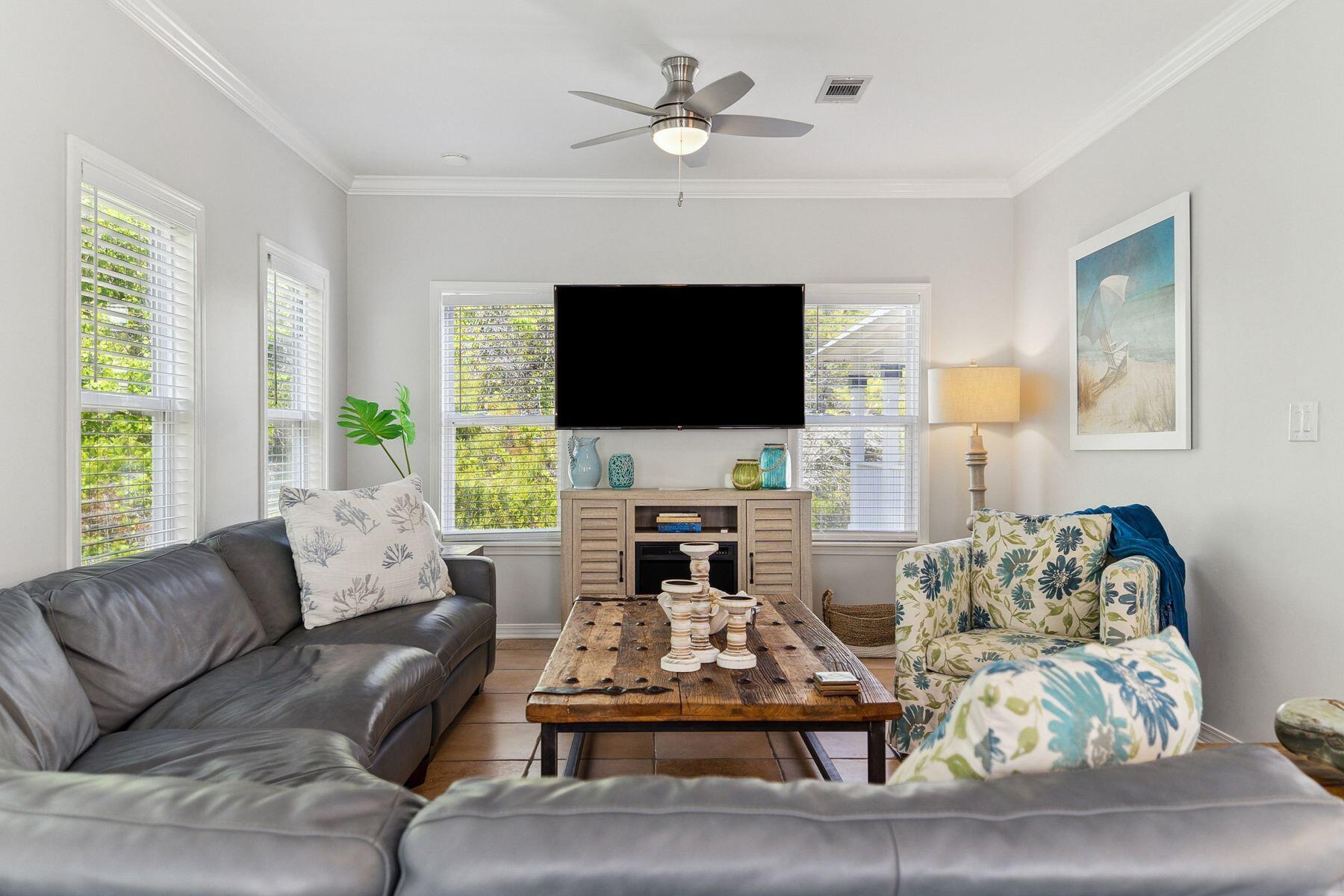 104 Emerald Dunes Circle Santa Rosa Beach, FL 32459 - Photo 10 of 53 a living room with furniture a fireplace and a flat screen tv