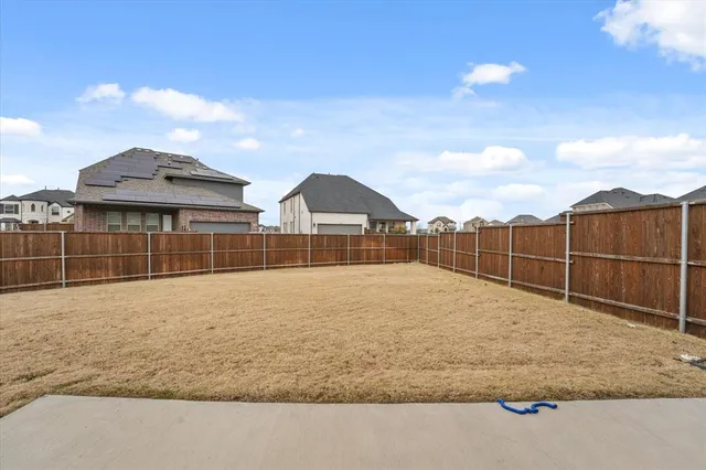 a view of outdoor space with wooden fence
