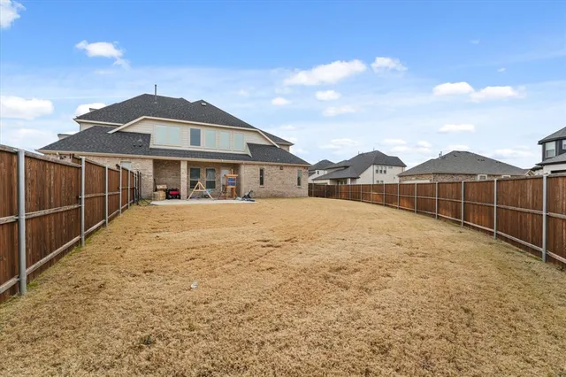 a view of house with wooden fence