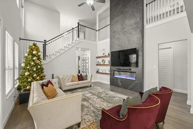 a living room with furniture and a flat screen tv