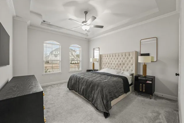 a spacious bedroom with a bed and window