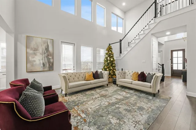 a living room with furniture or couch and a large window