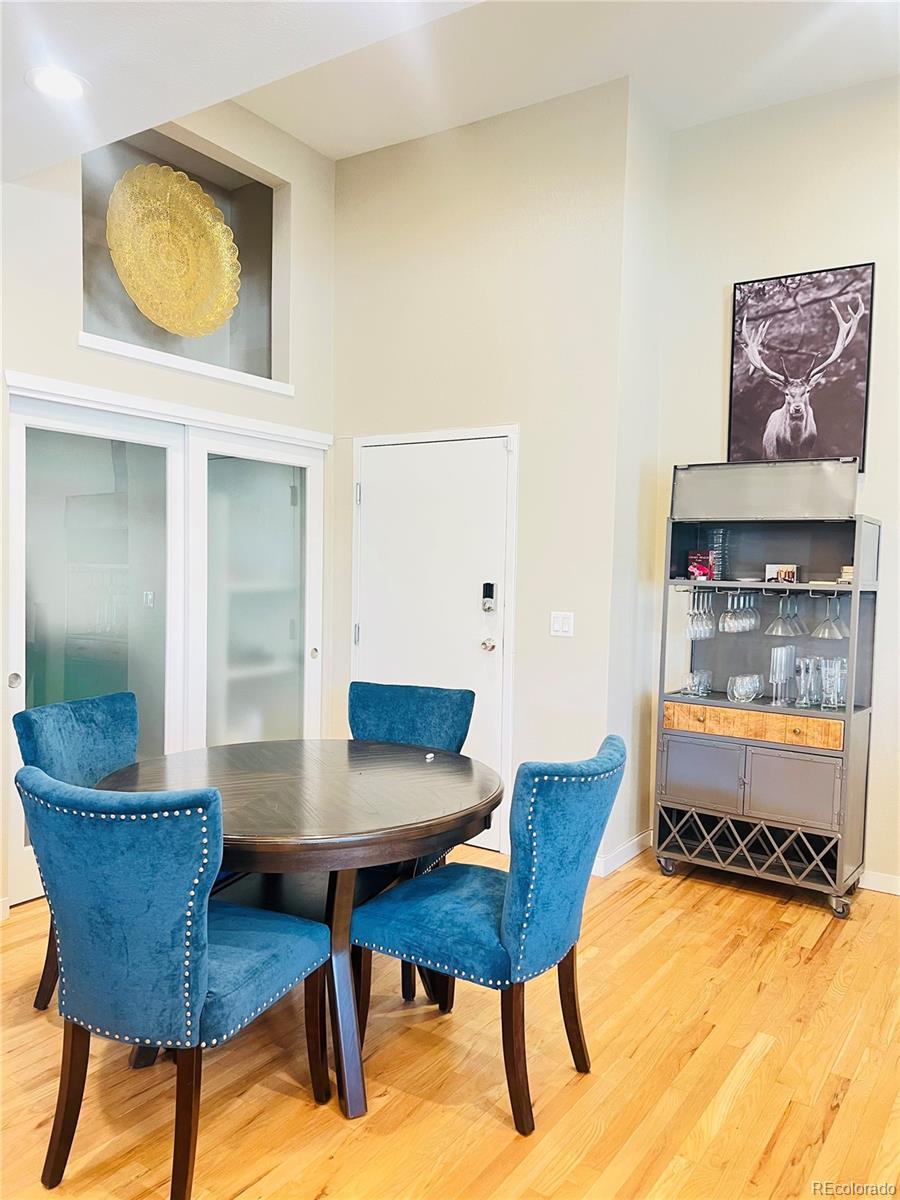 3240 Tejon Street, Unit 103 Denver, CO 80211 - Photo 3 of 18 a living room with furniture and a wooden floor