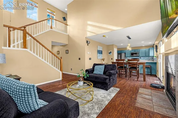 a living room with furniture and a table