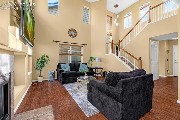 a living room with furniture and a large window