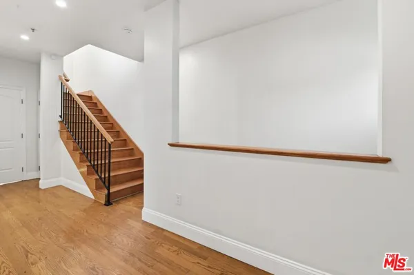 a view of a hallway with staircase