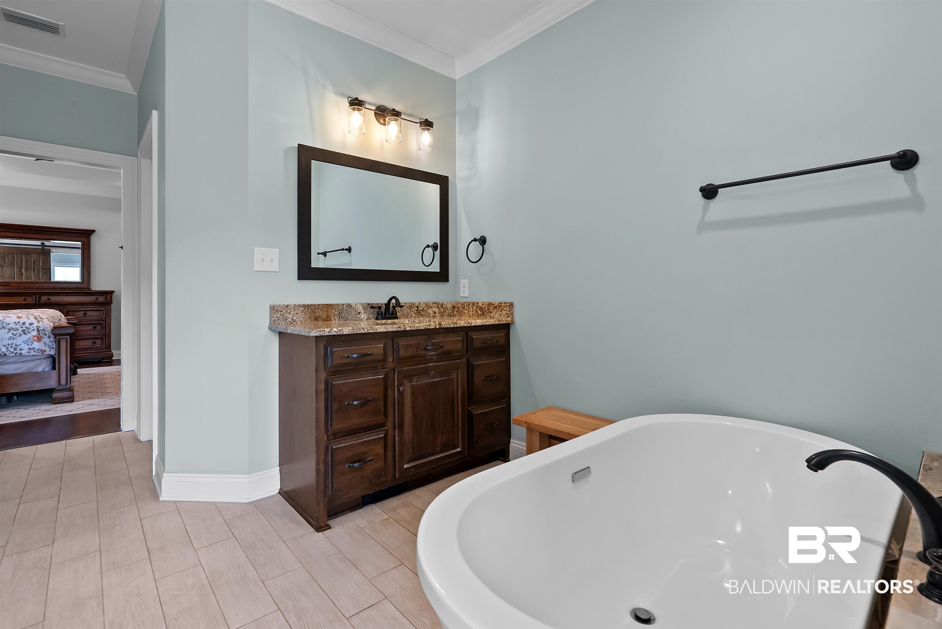 12070 Comalander Road Fairhope, AL 36532 - Photo 23 of 50 Freestanding white bathtub with dark bronze fixtures