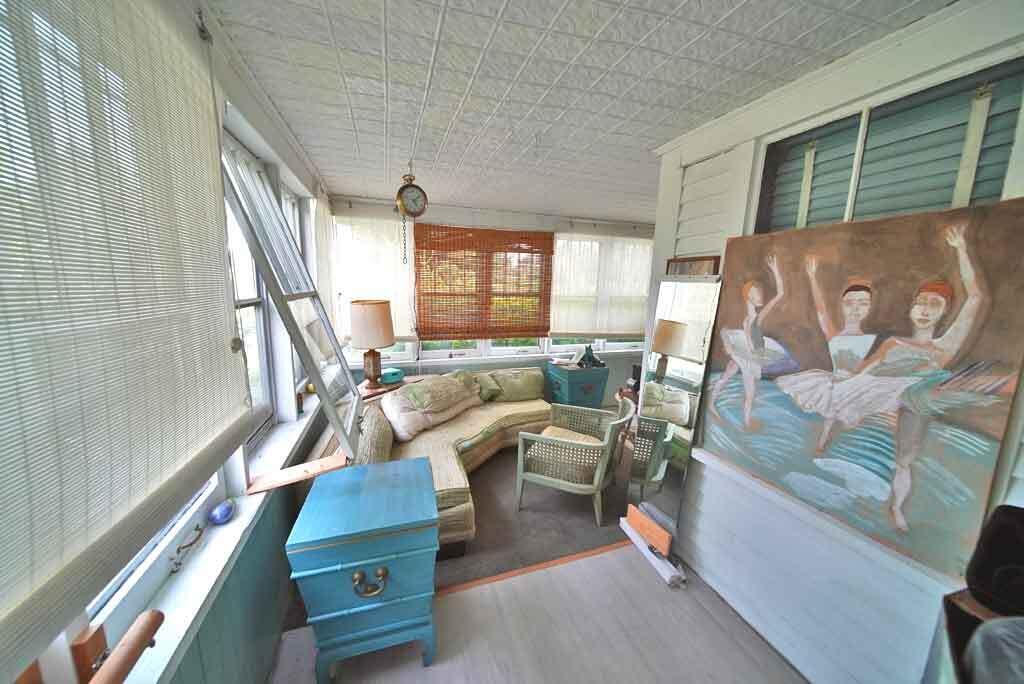 95 Sunset Park Road Orient, ME 04471 - Photo 31 of 66 wrap-around-porch-tin-ceili