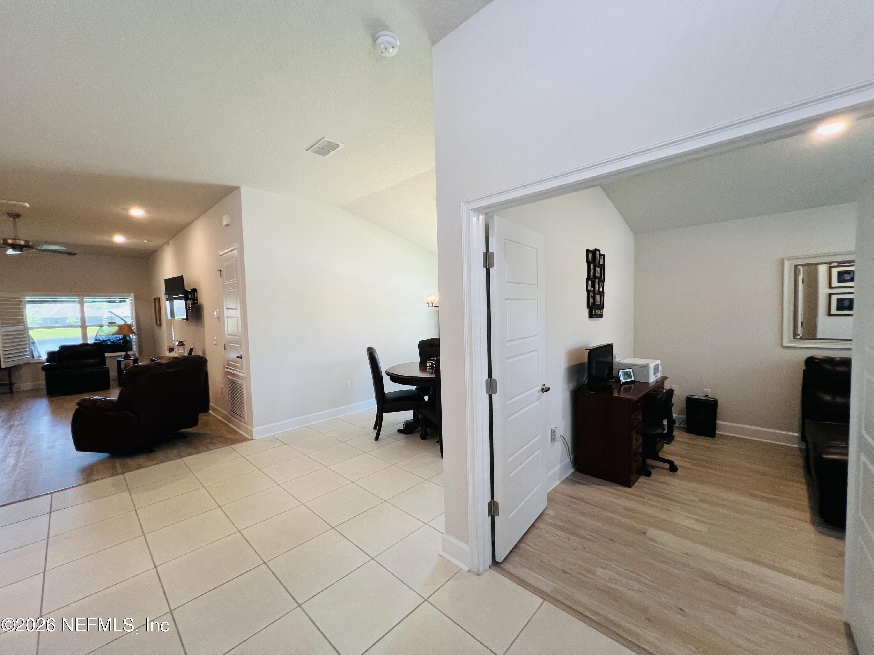 2 Rivertown Road Palm Coast, FL 32137 - Photo 27 of 80 a living room with furniture and a flat screen tv