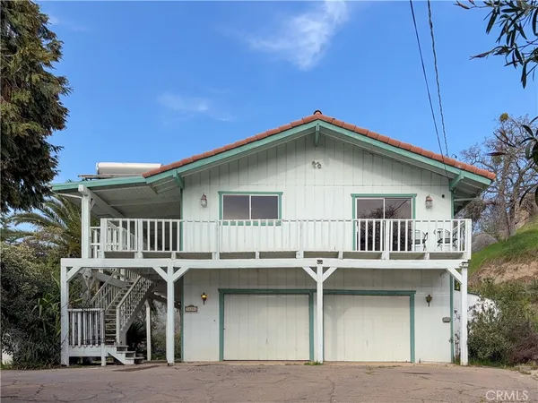 a front view of a house with a garage