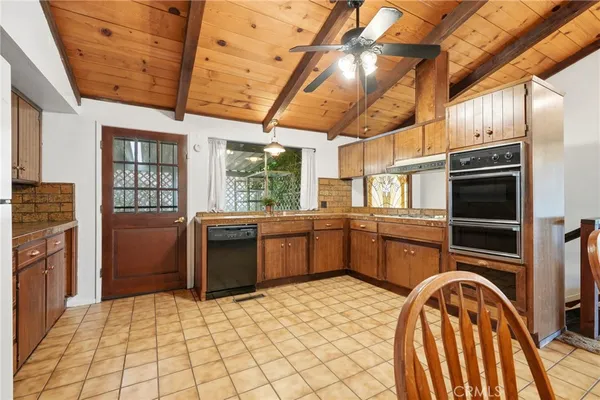 a kitchen with a stove a sink and a microwave