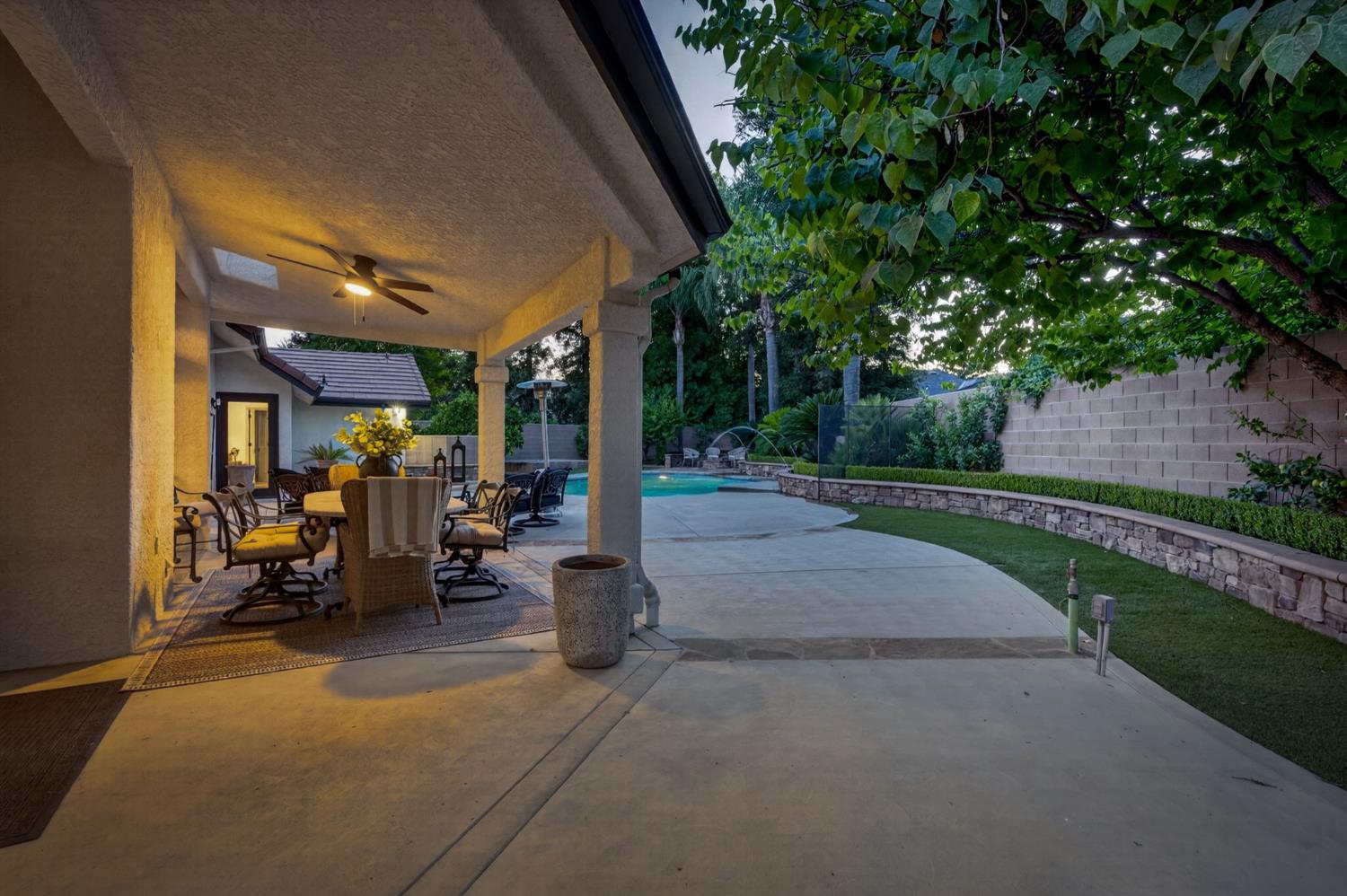 601 Decatur Avenue Clovis, CA 93611 - Photo 46 of 62 a view of a patio with table and chairs under an umbrella