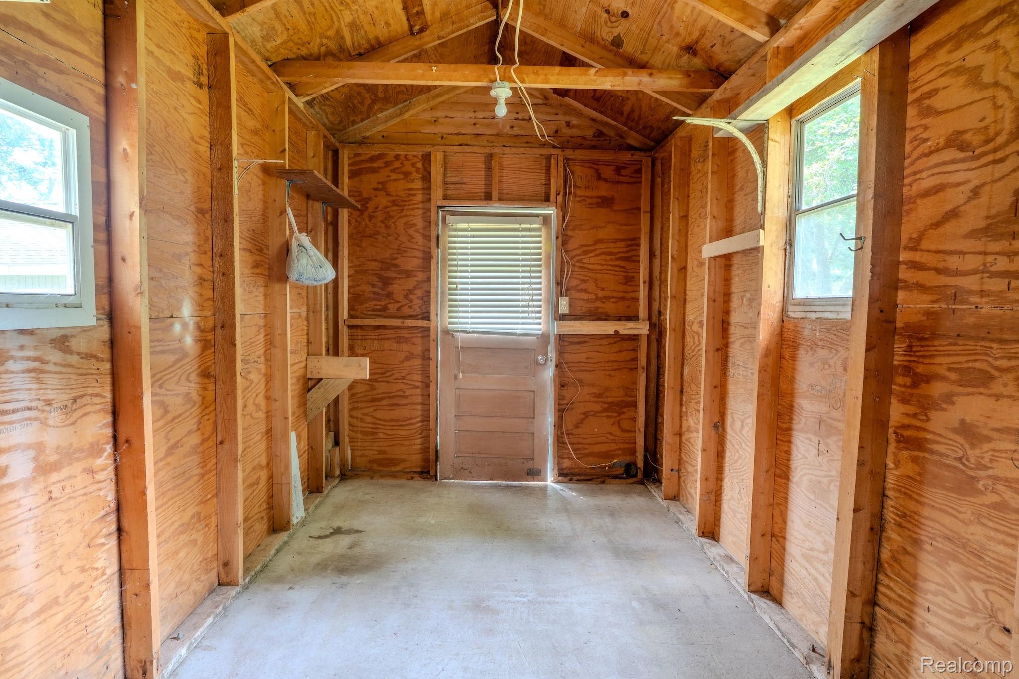 4350 Shrew Road Lincoln, MI 48742 - Photo 30 of 32 Utility structure interior with exposed wood-finish walls and ceiling rafters