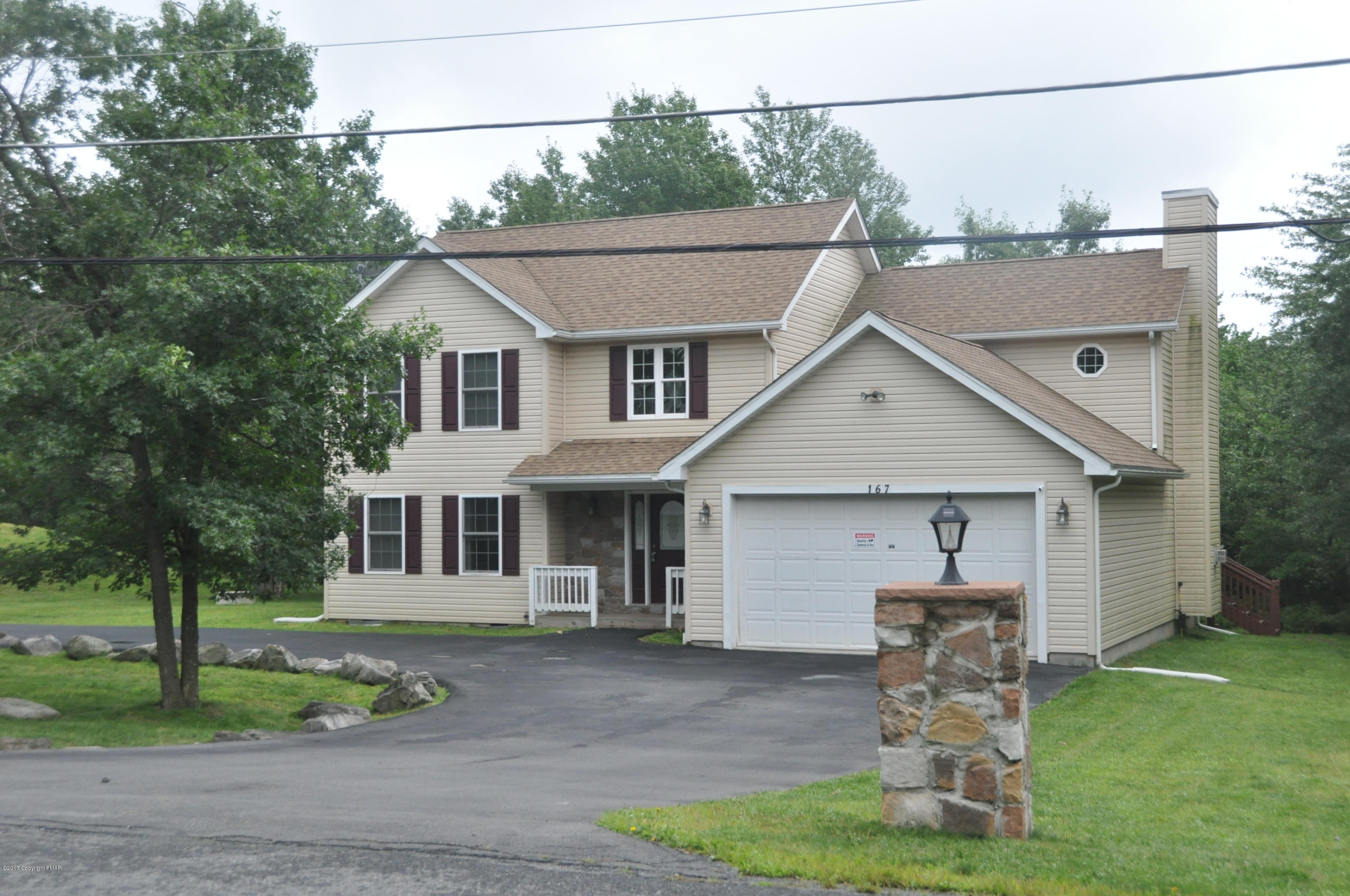 167 Sawmill Road Long Pond, PA 18334 - Photo 1 of 38 a front view of a house with garden