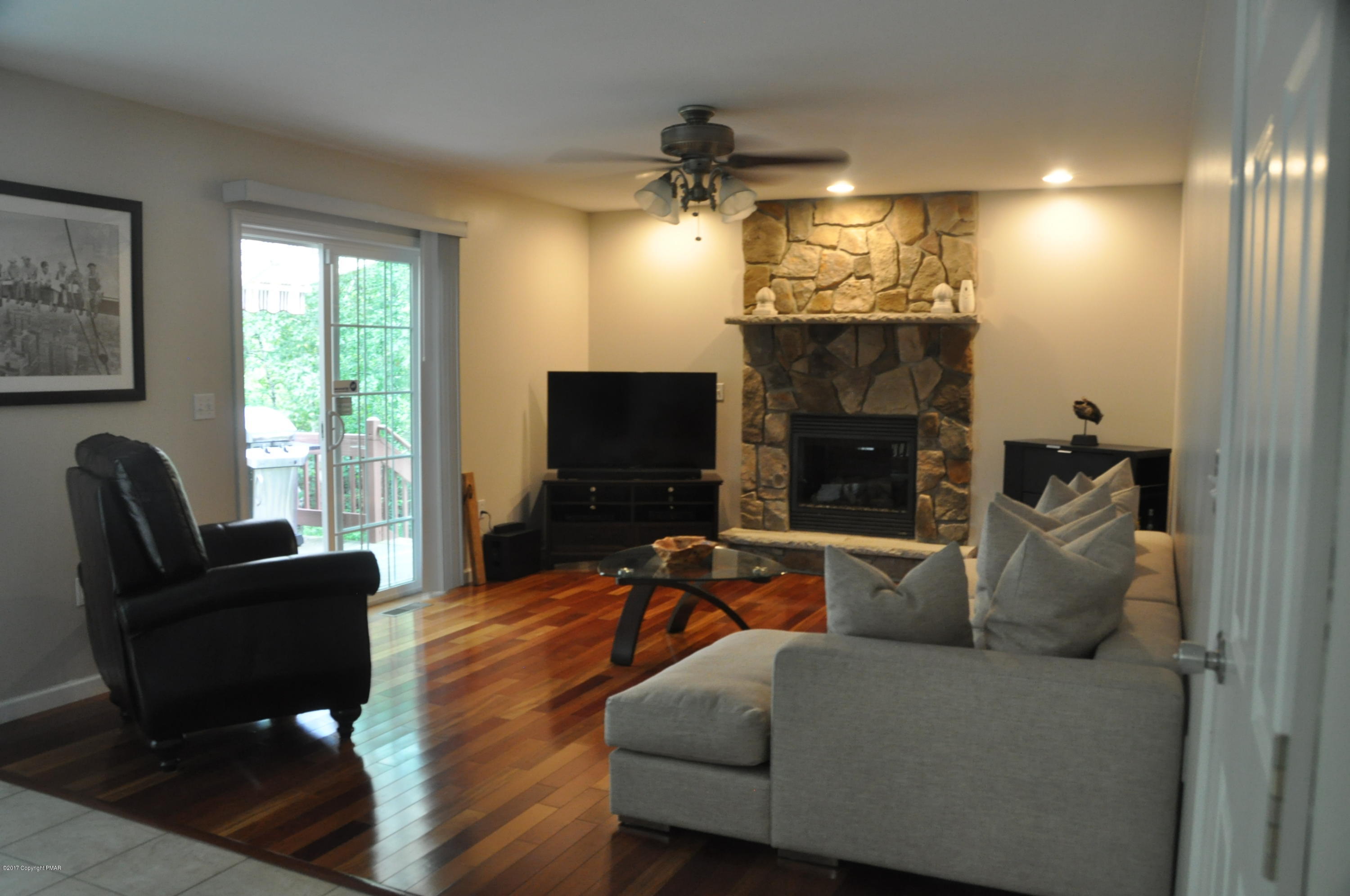 167 Sawmill Road Long Pond, PA 18334 - Photo 11 of 38 a living room with furniture and a fireplace