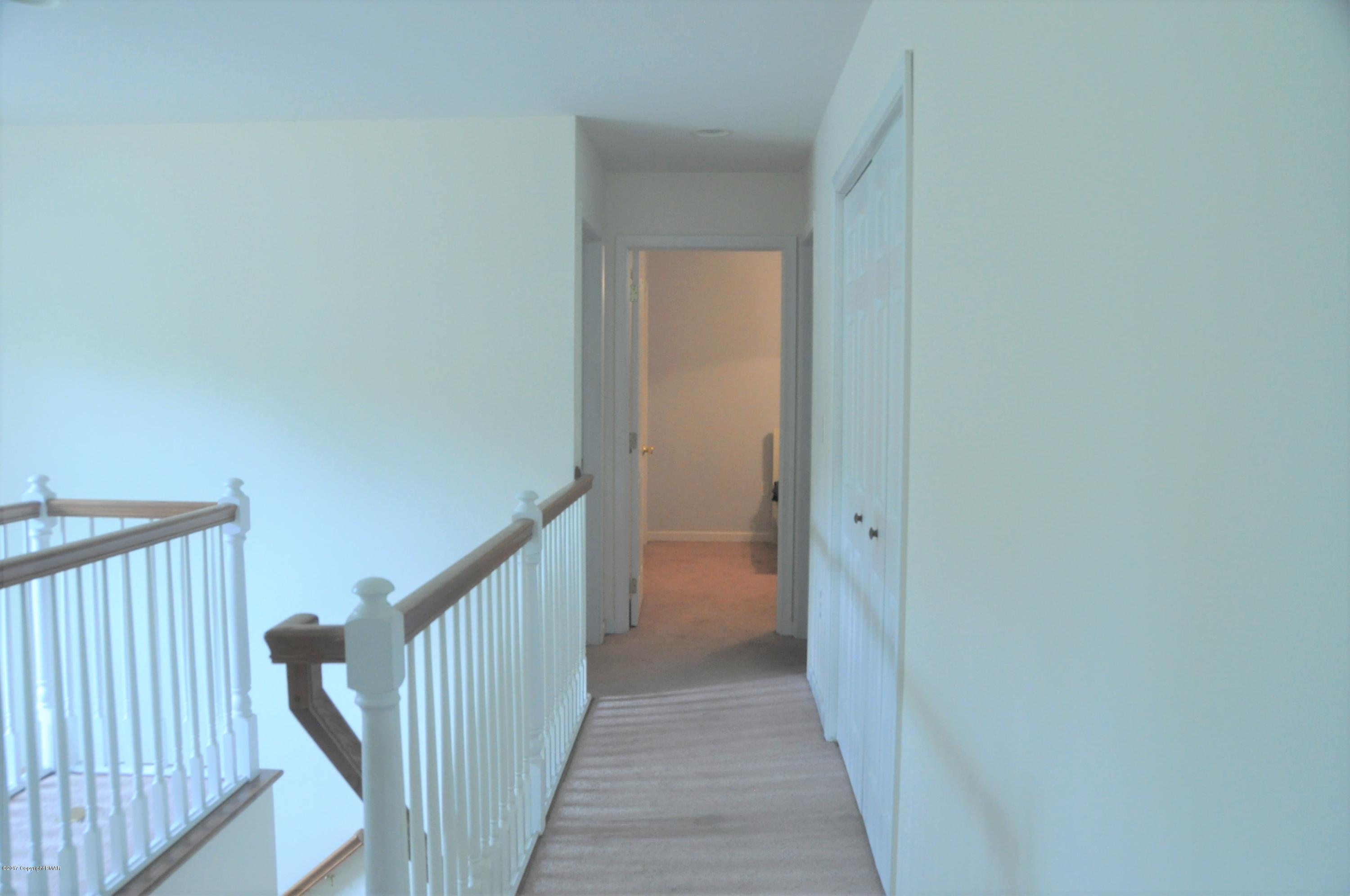167 Sawmill Road Long Pond, PA 18334 - Photo 16 of 38 a view of a hallway with wooden floor