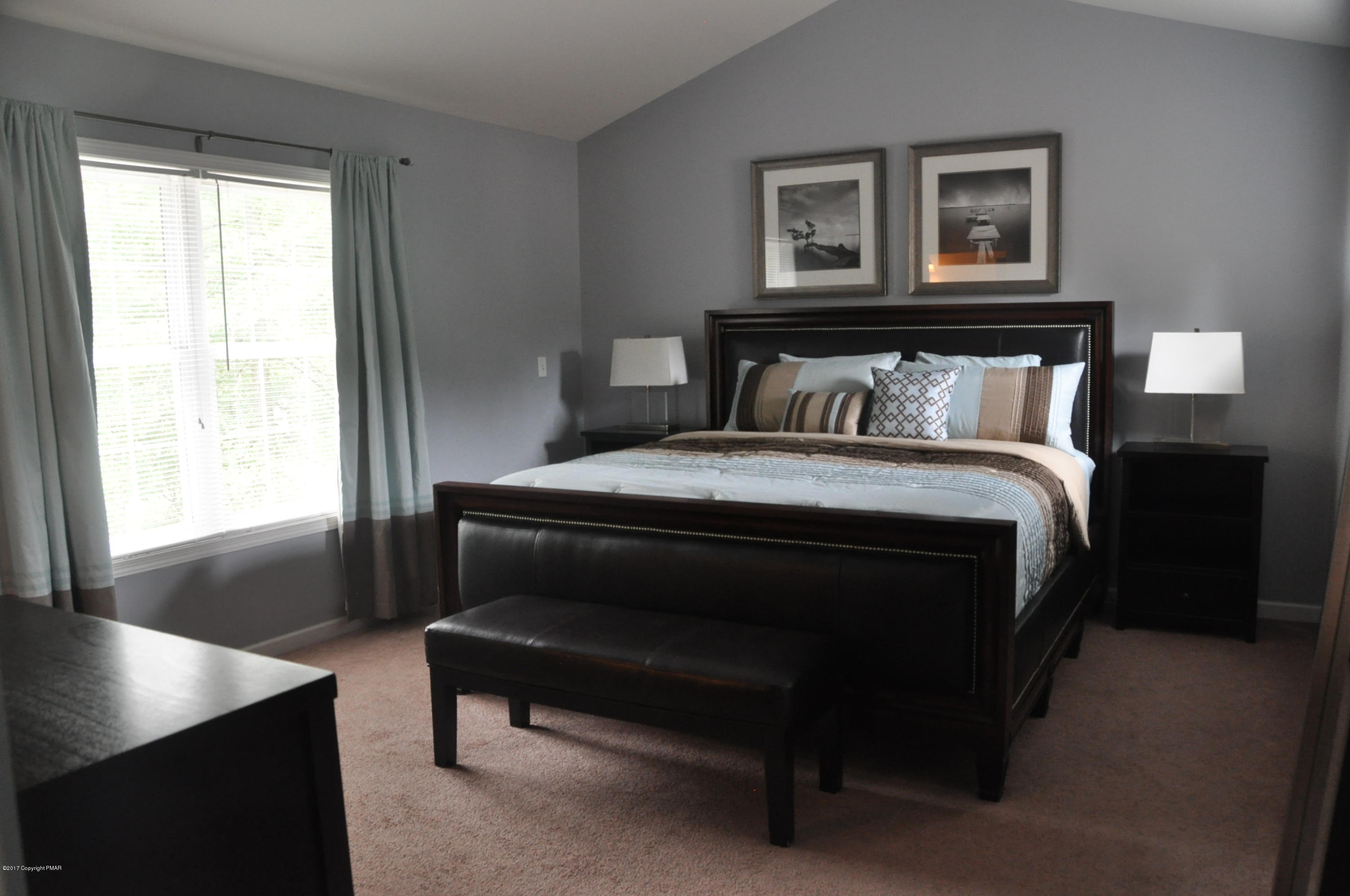 167 Sawmill Road Long Pond, PA 18334 - Photo 18 of 38 a bedroom with a bed and a window