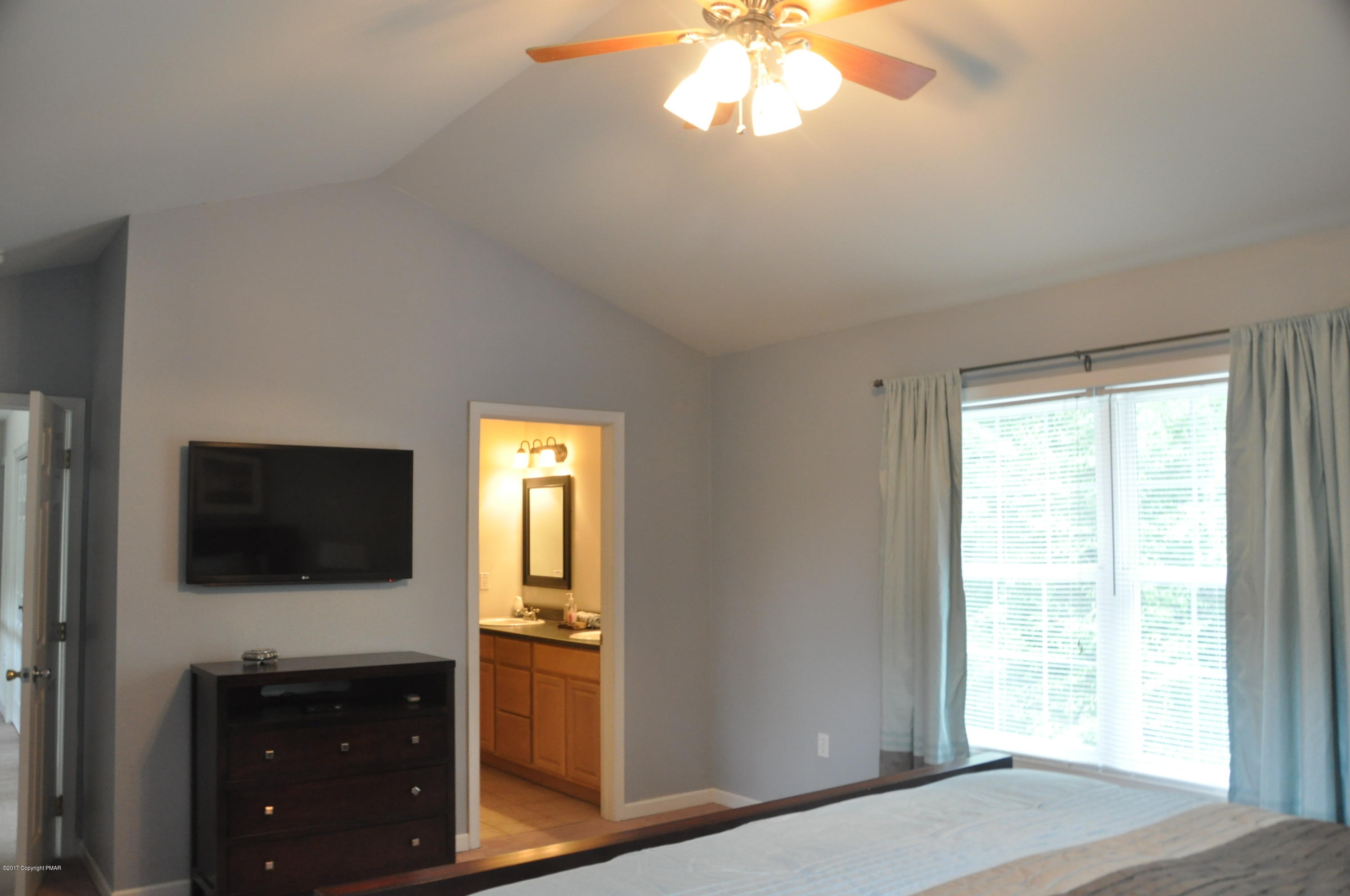 167 Sawmill Road Long Pond, PA 18334 - Photo 21 of 38 a view of empty room with window and flat screen tv