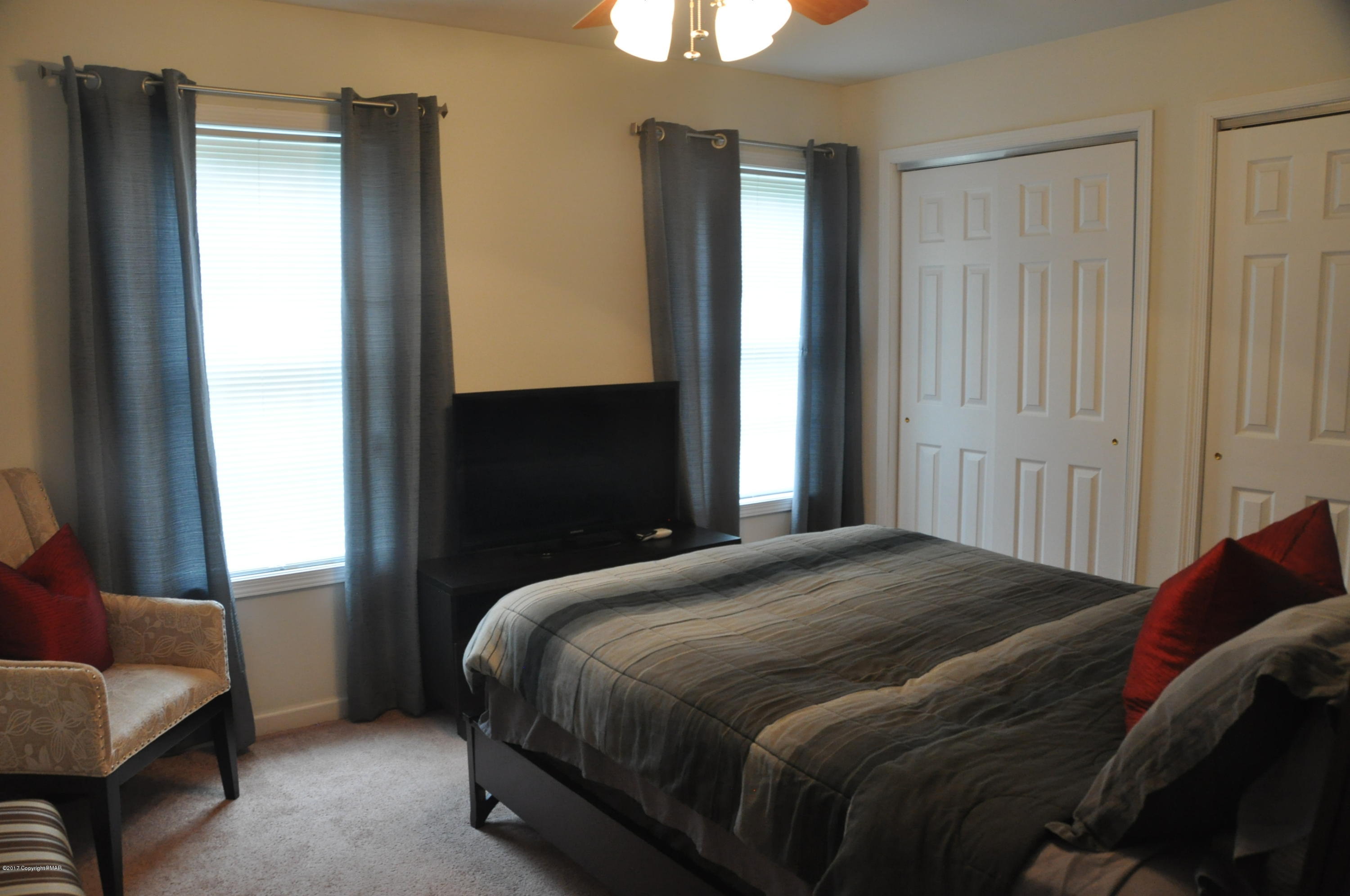 167 Sawmill Road Long Pond, PA 18334 - Photo 26 of 38 a bedroom with a bed and a window