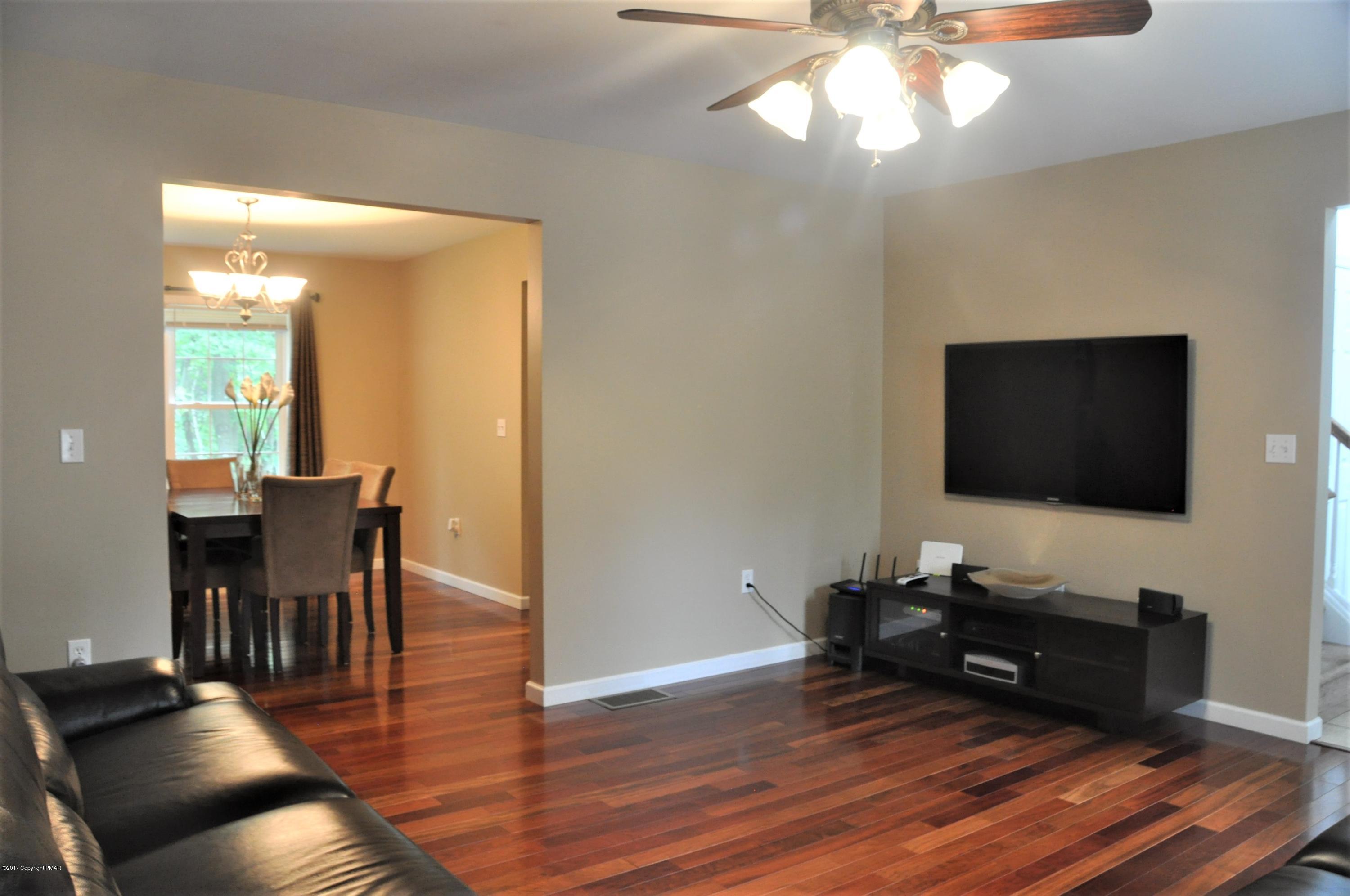 167 Sawmill Road Long Pond, PA 18334 - Photo 7 of 38 a living room with furniture and a flat screen tv