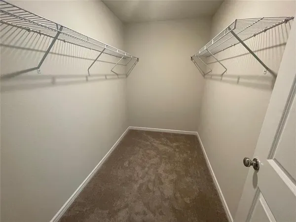 a bathroom with a double vanity sink mirror and shower