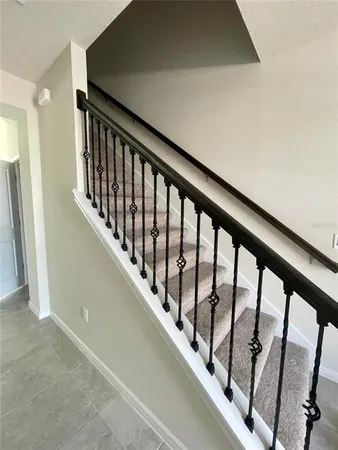a view of staircase with lots of windows